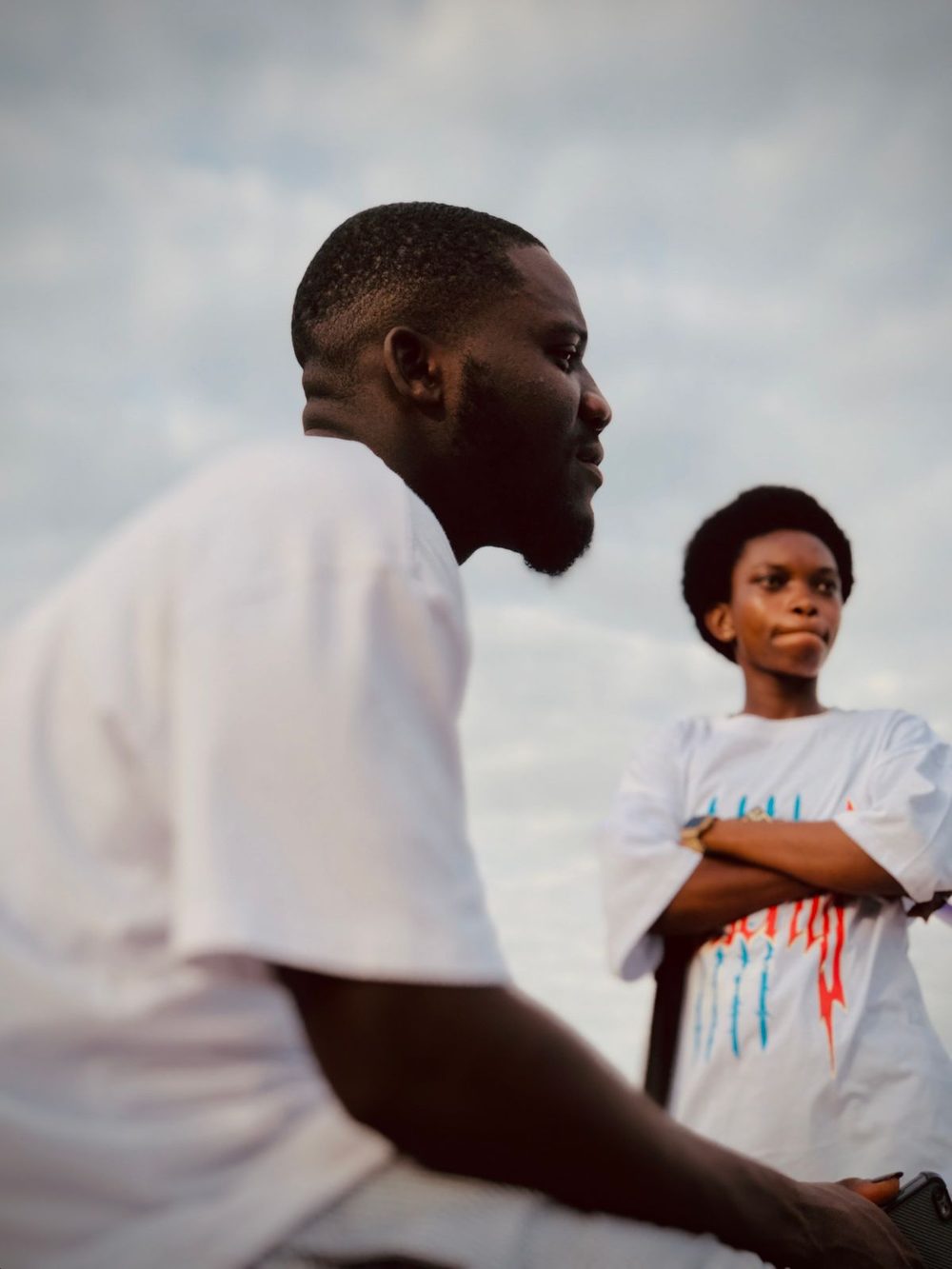 A mentor and a young boy outdoors